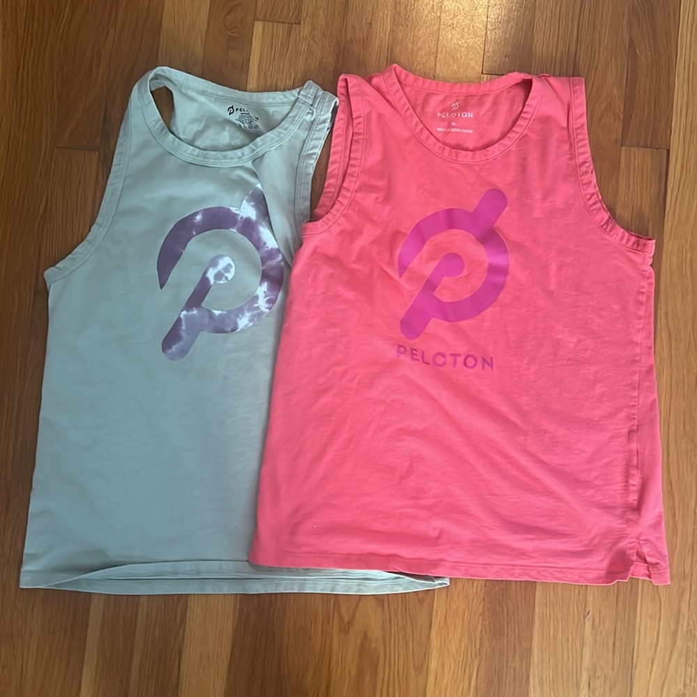 Peloton women’s muscle tanks. Two tank tops. Pink and light green. Size medium.